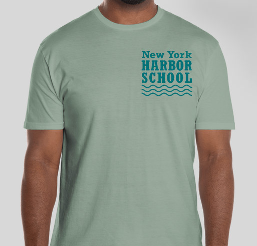Man wearing green t-shirt with "New York Harbor School" written on it.