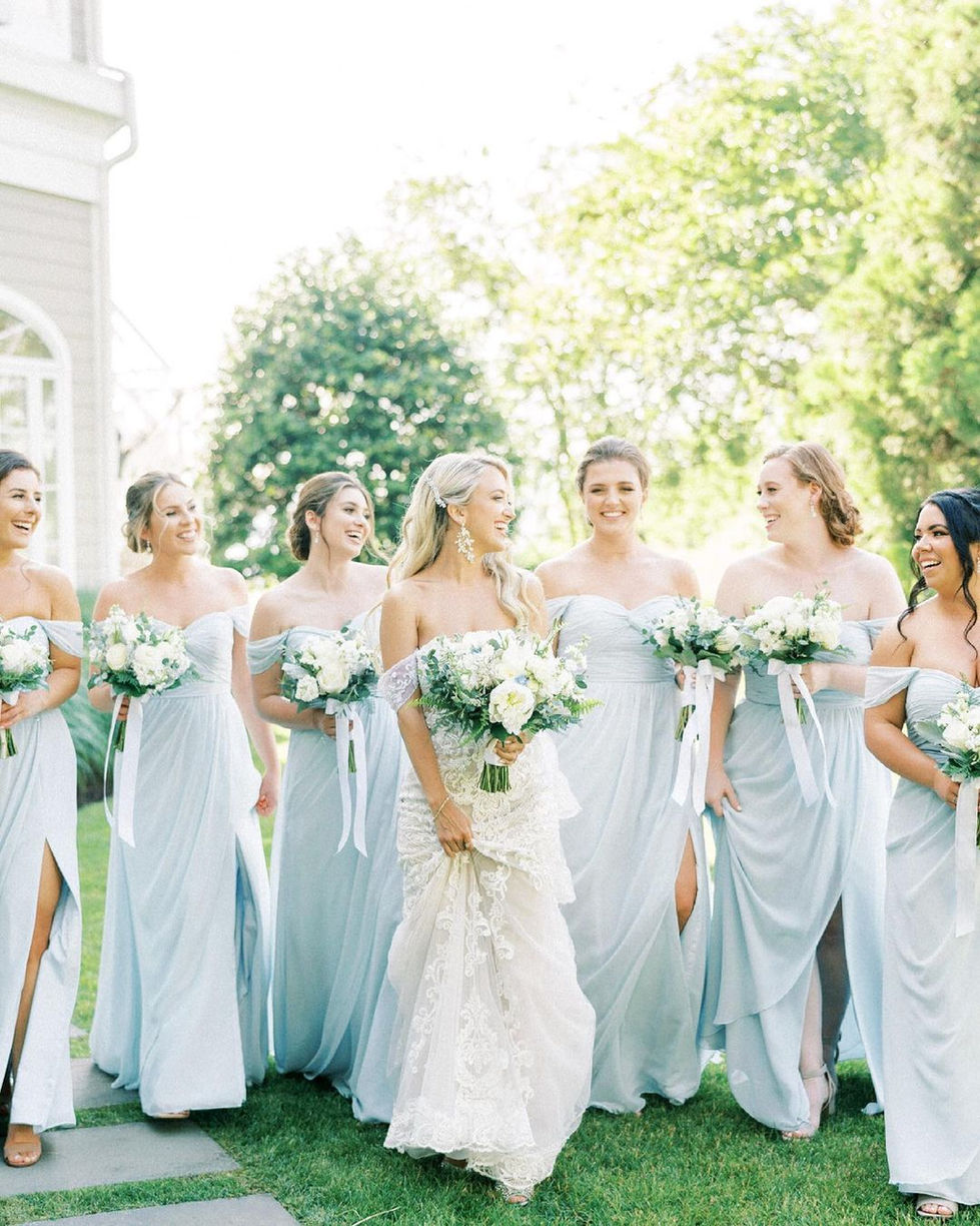 the bride and her bridesmaids are wearing light blue dresses
