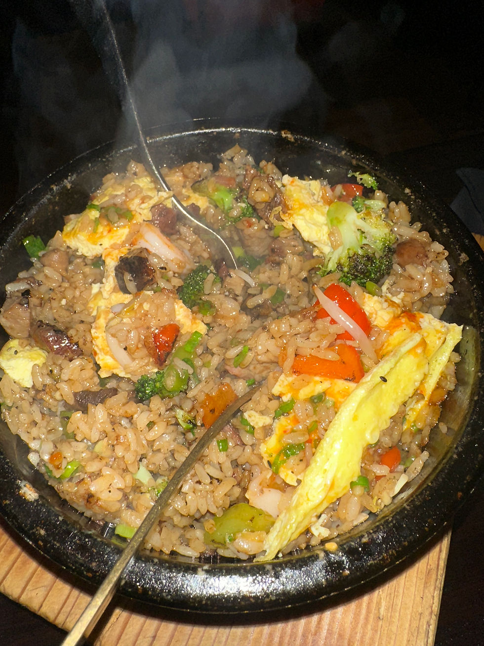 Chaufa Aeropuerto fried rice with pork, shrimp omelette, and sweet chili sauce.