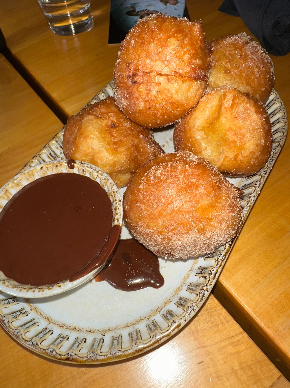 Cinnamon sugar donuts at Frasca in Chicago served warm with a rich espresso chocolate dipping sauce.