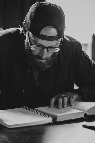 Michael Awolf portrait working on the desk and writing
