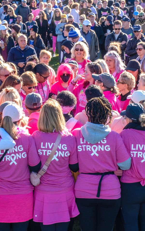 Breast Cancer Survivors in a Circle of Strength (TM) surrounded by supporters