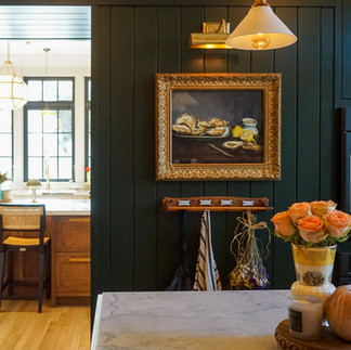 White Carrara marble countertops with an ogee edge in a scullery prep space designed for entertaining