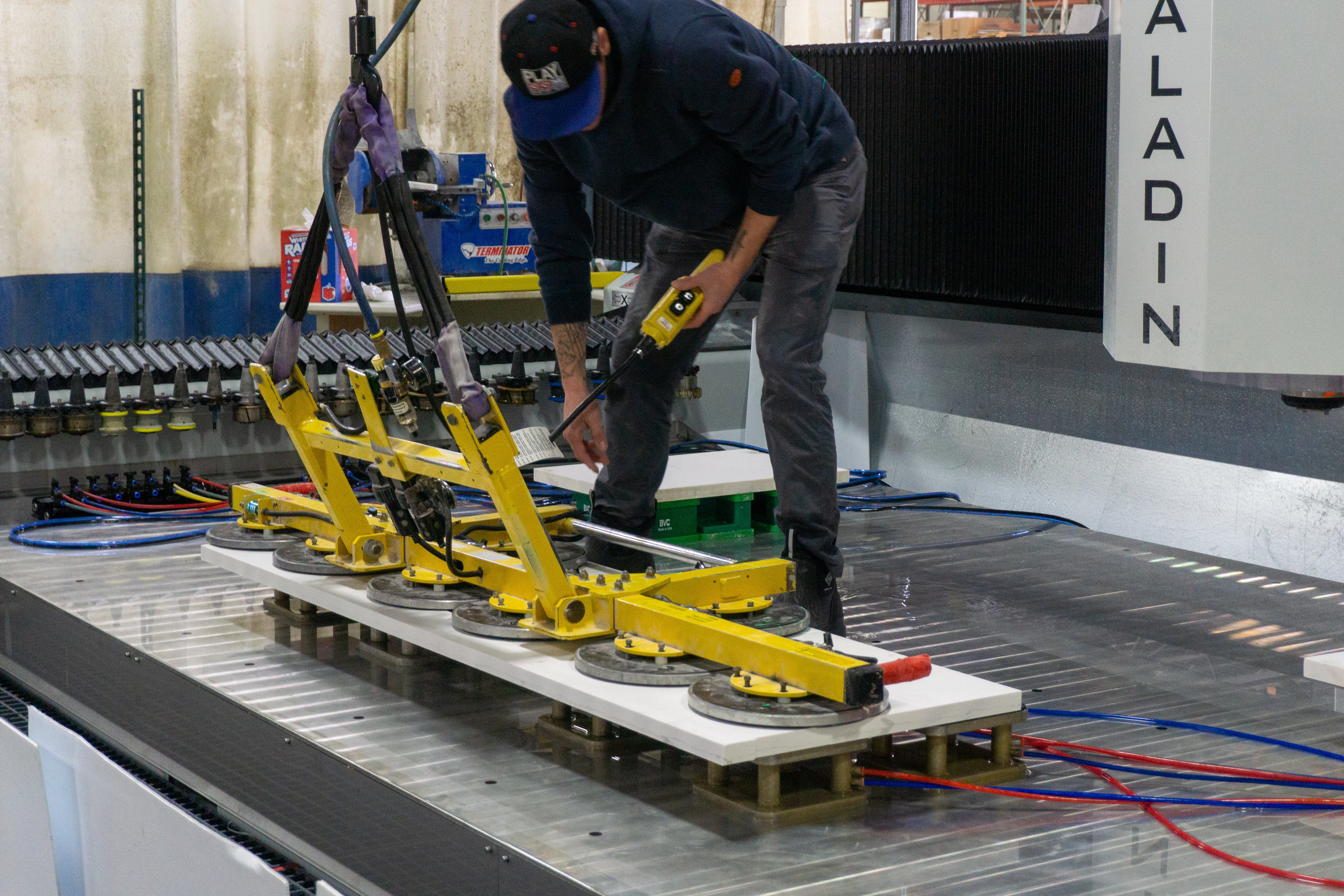 Gorilla Grip system placing a stone slab onto the Paladin CNC stone mill for fabrication
