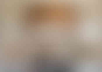 Quartzite countertops paired with custom cabinetry and full height splash for a refined, timeless kitchen design.