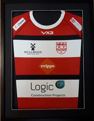 Framed red and white sports jersey with black stripes