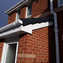 Red brick house with soffits, fascias and gutters