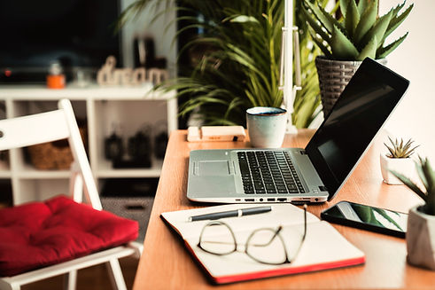 close-up-view-wooden-desk-with-laptop-planner-mobile-phone-eyeglasses-left-work-table_edit