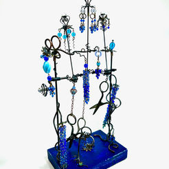 A colorful automata sculpture featuring scissors that dance when crank mechanism is turned. By Richard Bradley from My Pink Planet. 