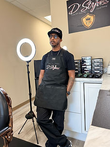 Kevin Smith: Barber shop owner, author, and barber mentor standing relaxed in D'Styles VIP Barber studio in Hiram, GA.