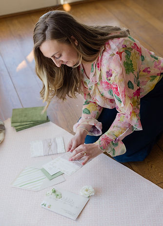 Hailey Kiss, wedding stationery designer and illustrator, working on a custom invitation suite