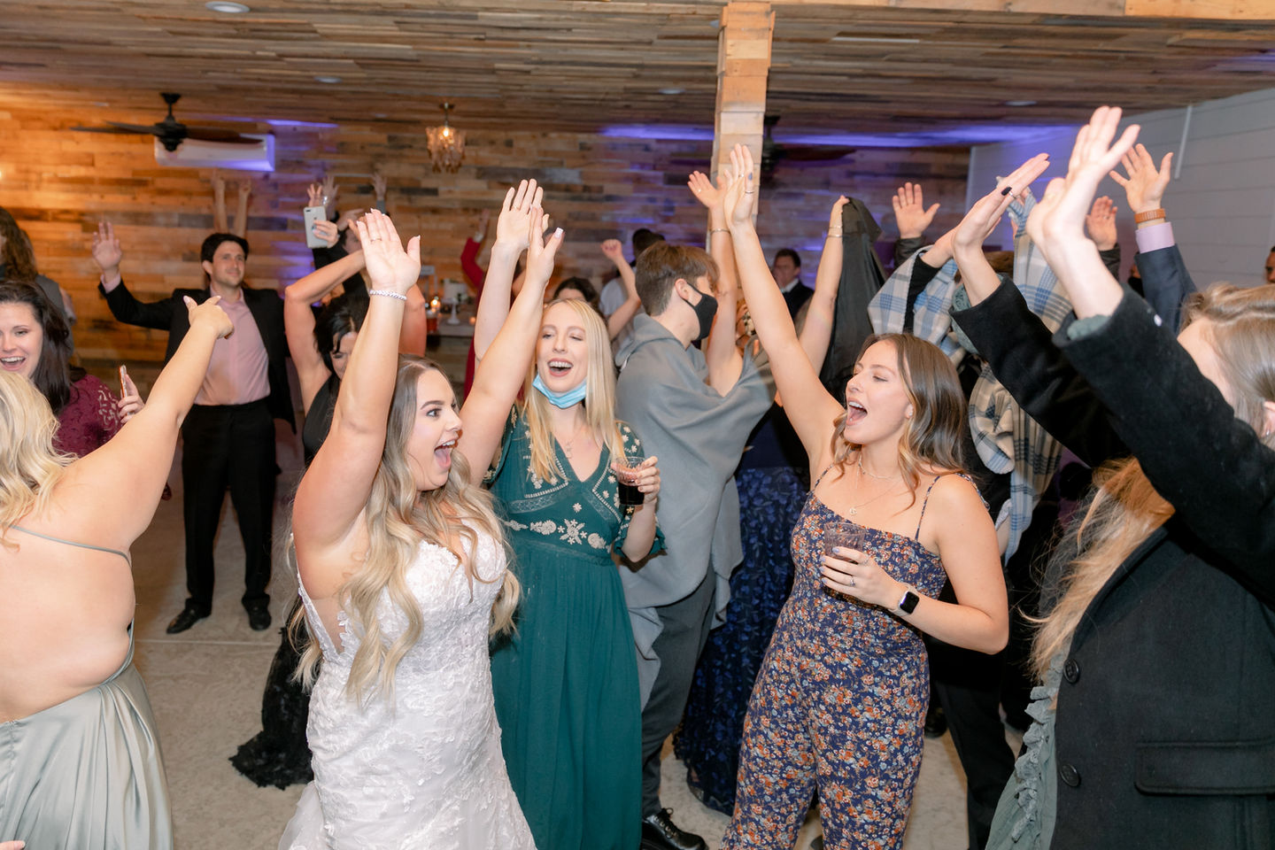 Bride and wedding guests dancing to a high-energy set by DJ Carlos Zavala.
