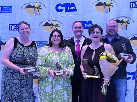 Five people at an awards banquet.
