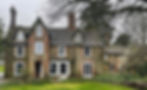 Old detached house with white framed windows