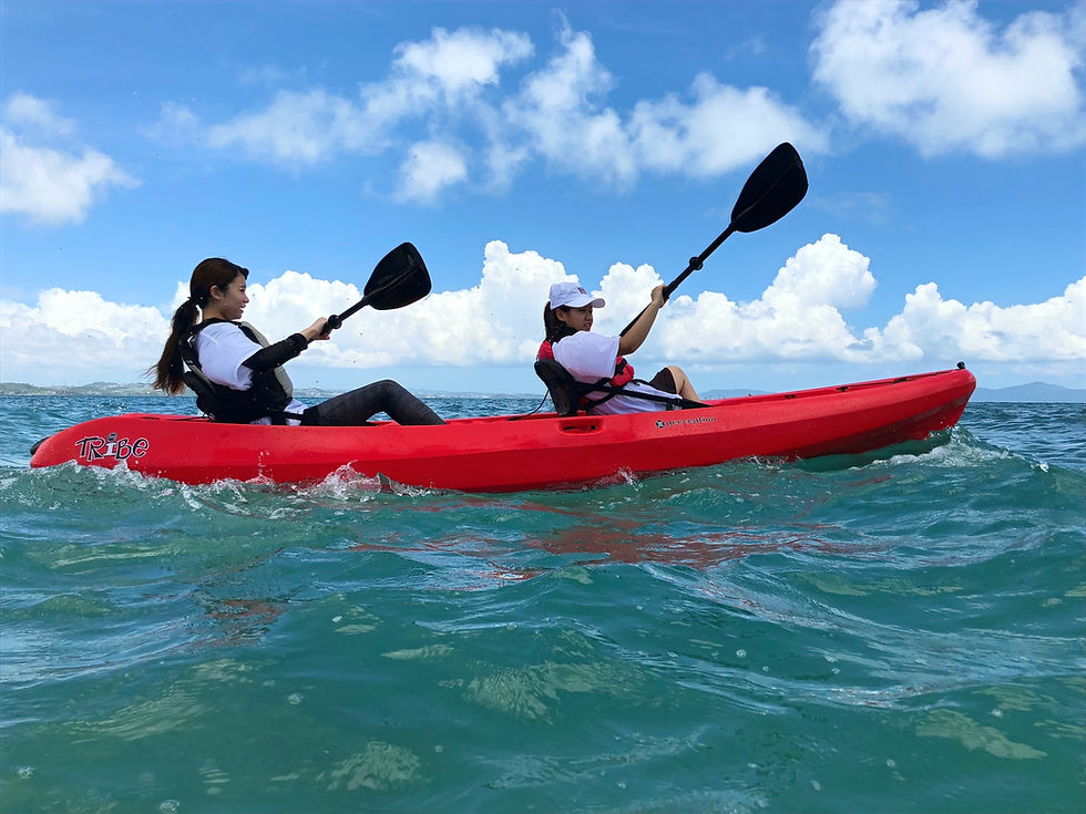 Students kayaking in Okinawa during a supervised outdoor education activity