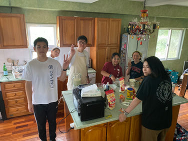 Students completing a supervised food-preparation activity at DA·VINCI International School