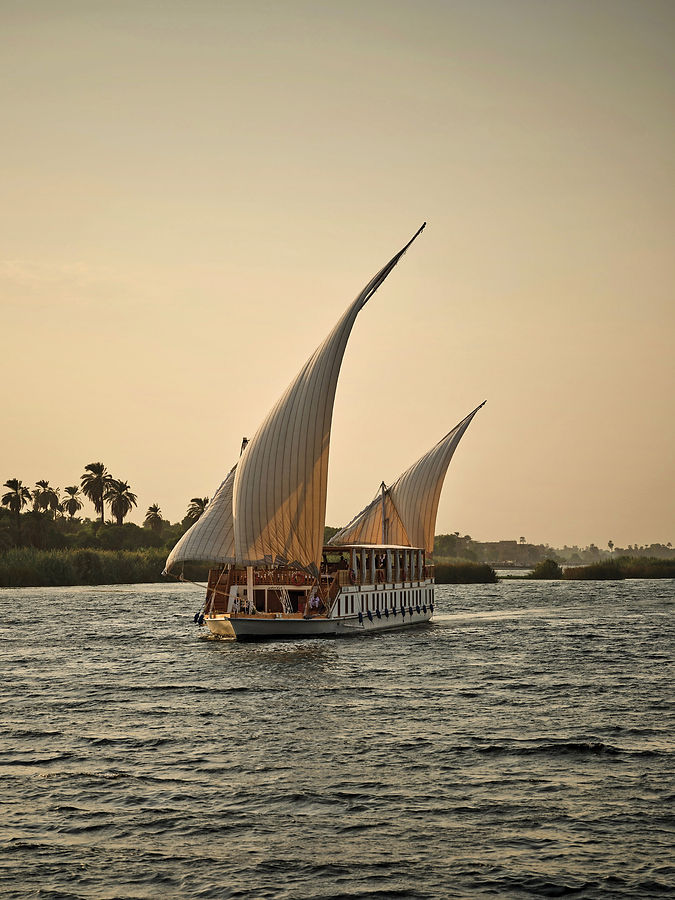 View of the Duwana Nile dahabey cruising on the Nile