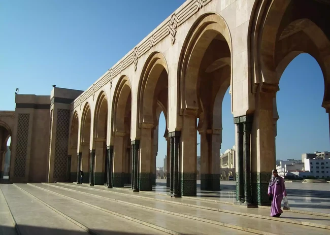 426648-woman-outside-the-hassan-ii-mosque-casablanca-morocco.webp