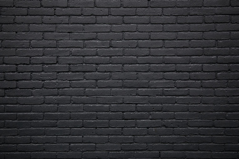 horizontal part of black painted brick wall.jpg