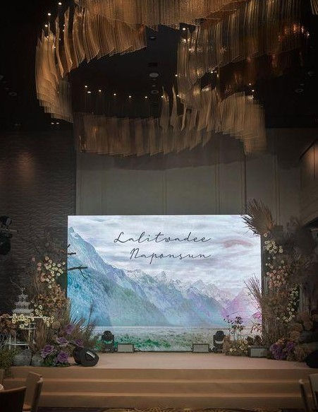Wedding guests enjoying a luxury reception enhanced by LED wall visuals