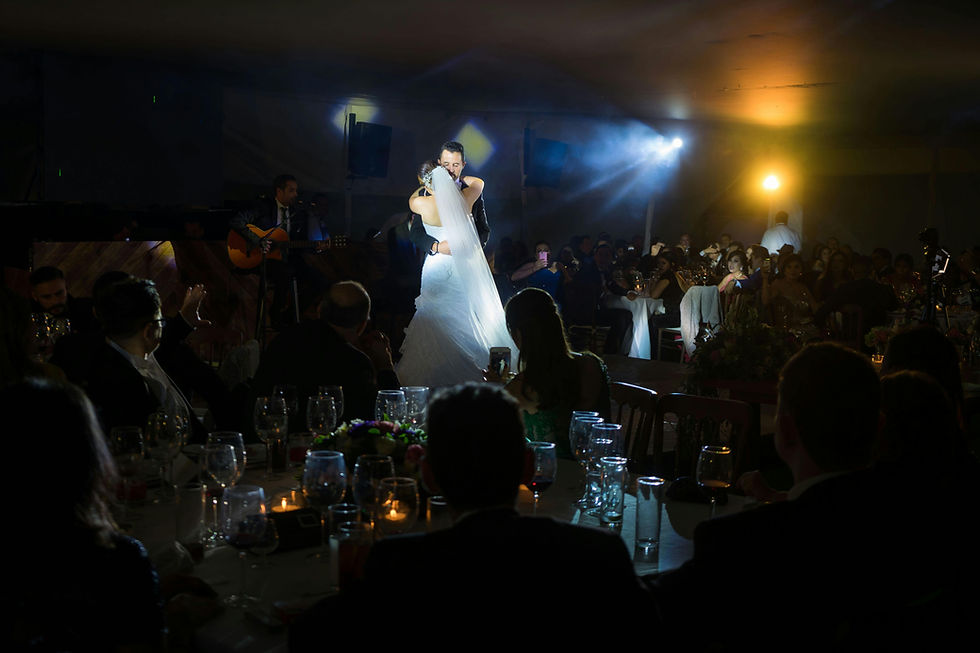 wedding lighting mood during first dance with spotlight creating romantic and cinematic atmosphere