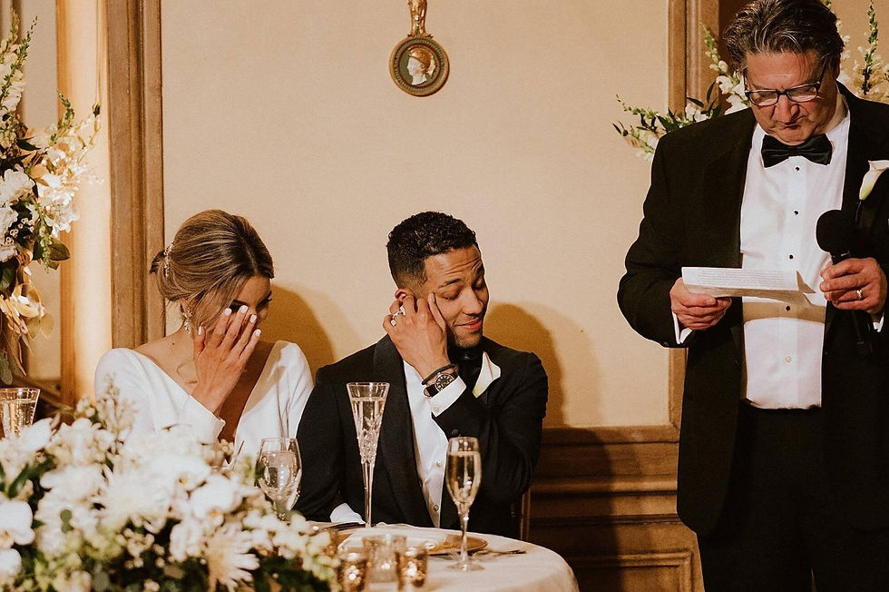 Wedding guest delivering a heartfelt toast while the couple listens during a luxury wedding reception with a carefully planned reception timeline.