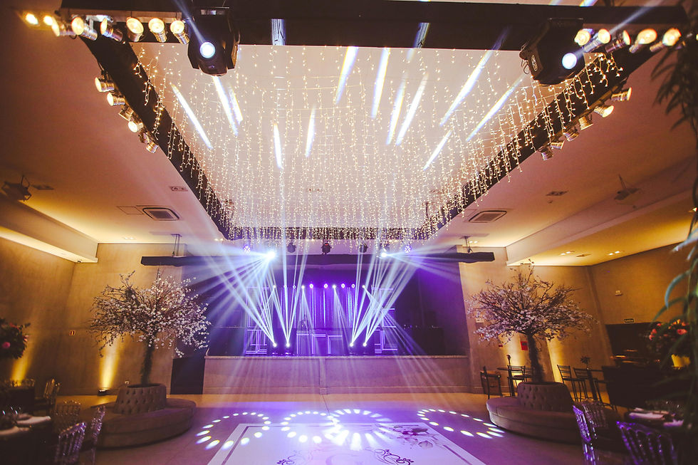 Elegant luxury wedding reception showcasing the dramatic impact of intelligent automated lighting on the dance floor and ceiling.