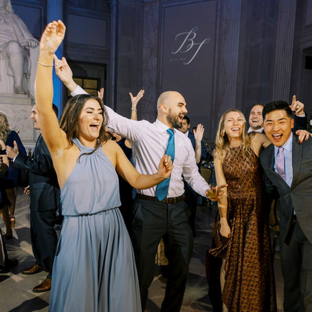 Guests celebrating on a packed dance floor at a luxury wedding reception, showcasing premium wedding entertainment and high-end DJ services in an elegant venue.