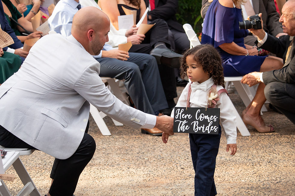 Young child participating in a wedding ceremony, highlighting kids at weddings activities and family friendly wedding ideas that make celebrations welcoming for all generations.