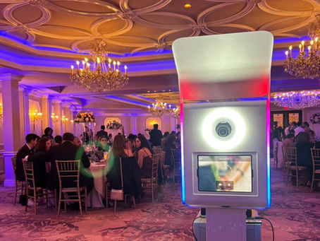 Elegant wedding selfie station with LED ring light in ballroom setting, offering no print photobooth for budget wedding photo fun through a user-friendly digital selfie booth.