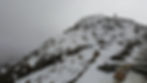 Snow on mountain summit, rocks, steps