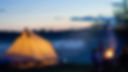 Camping near woodland with bell tent and fire