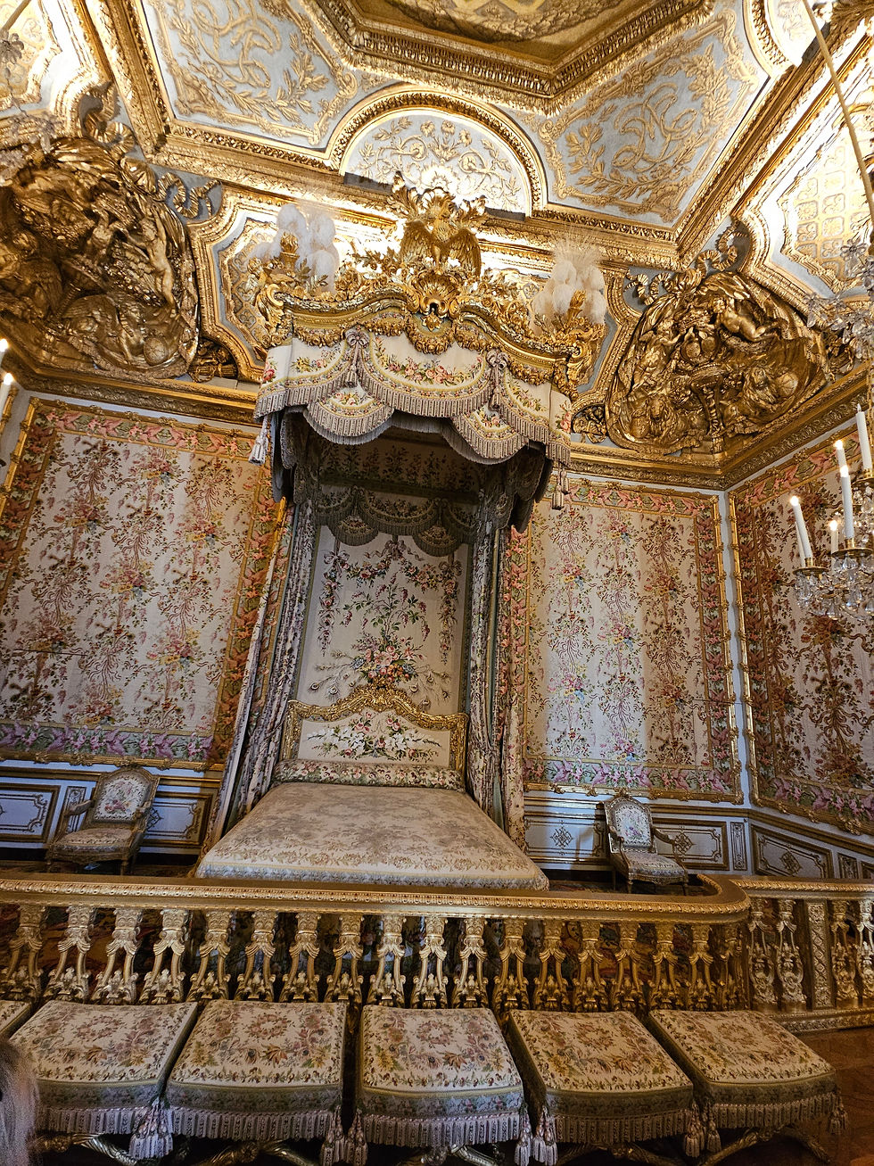 This is the queens bed chamber. There's a door on the left that blends into the wallpaper. This is the door that the queen escaped through when the commoners had enough of royalty, attacked the palace and attempted to hang the queen and king.