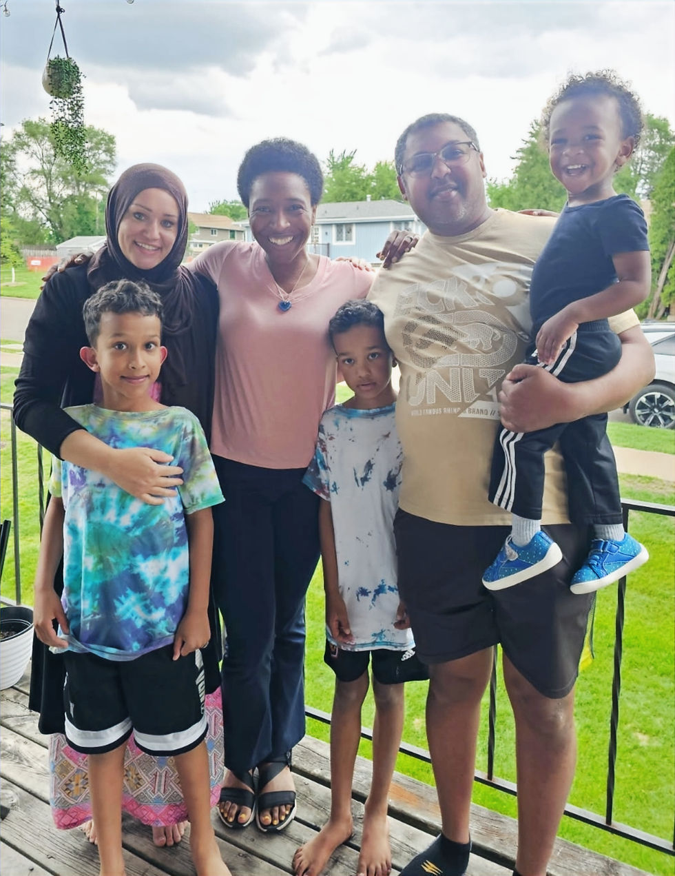 Tarik, Alex, Danielle, Aiman, Brett, Atlas outside on the porch at Alex's home.