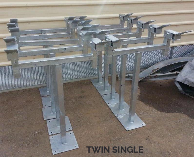 Thumbnail: A collection of several galvanised twin single head bin stands, all standing up in a row, side by side