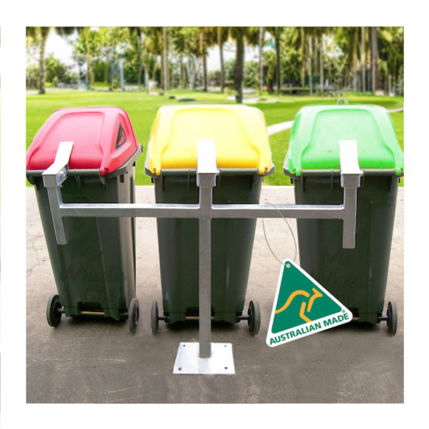 Galvanised triple single bin stand, bolted to the concrete, holding three wheelie bins, in a park setting