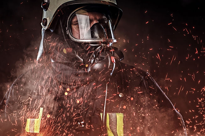 professional-firefighter-dressed-uniform-oxygen-mask-standing-fire-sparks-smoke-dark-backg
