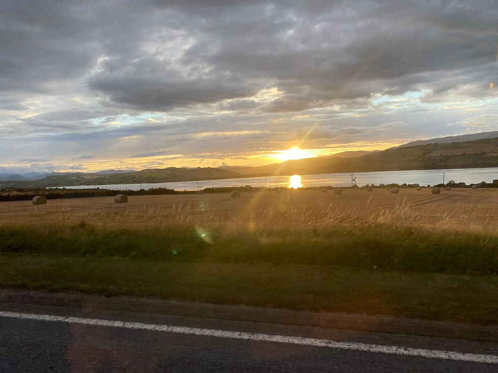 Sunset view over the Cromarty Firth with text encouraging people not to fly tip and to use a licensed removal service