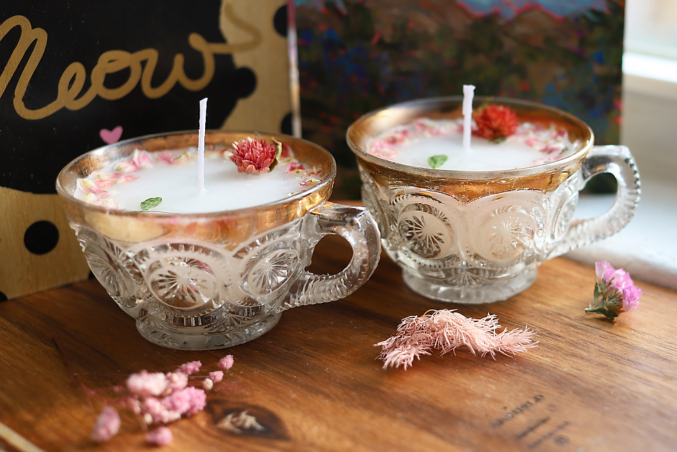 Thumbnail: Two teacup candles with gold trim, floral accents on a wooden table.