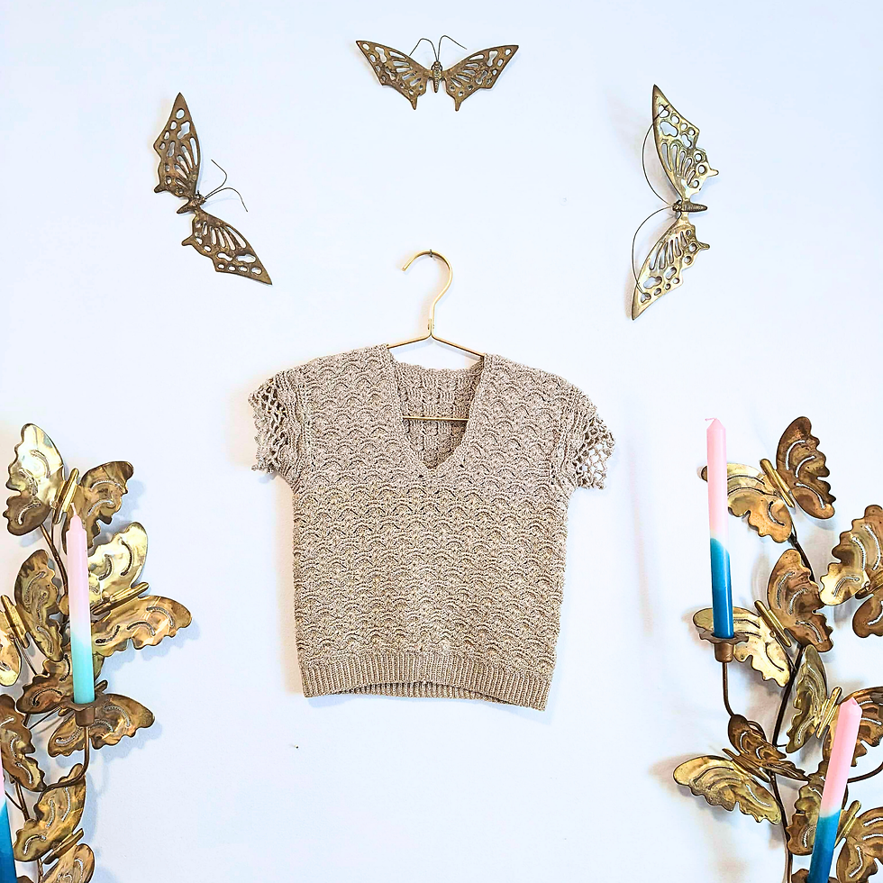 Thumbnail: Beige short sleeve shirt on a hanger with golden butterflies on wall