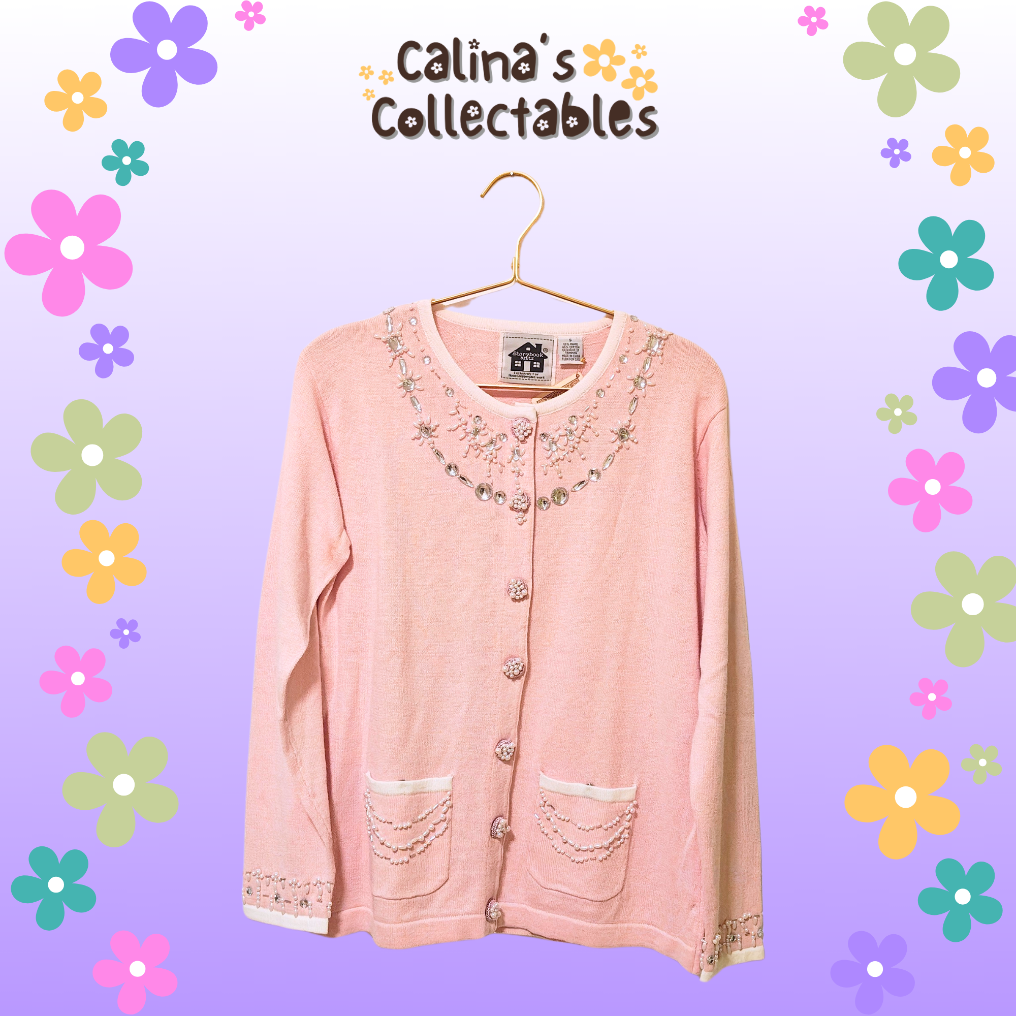 Pink sweater hanging, visible text: Calina's Collectables, floral background, cardigan.