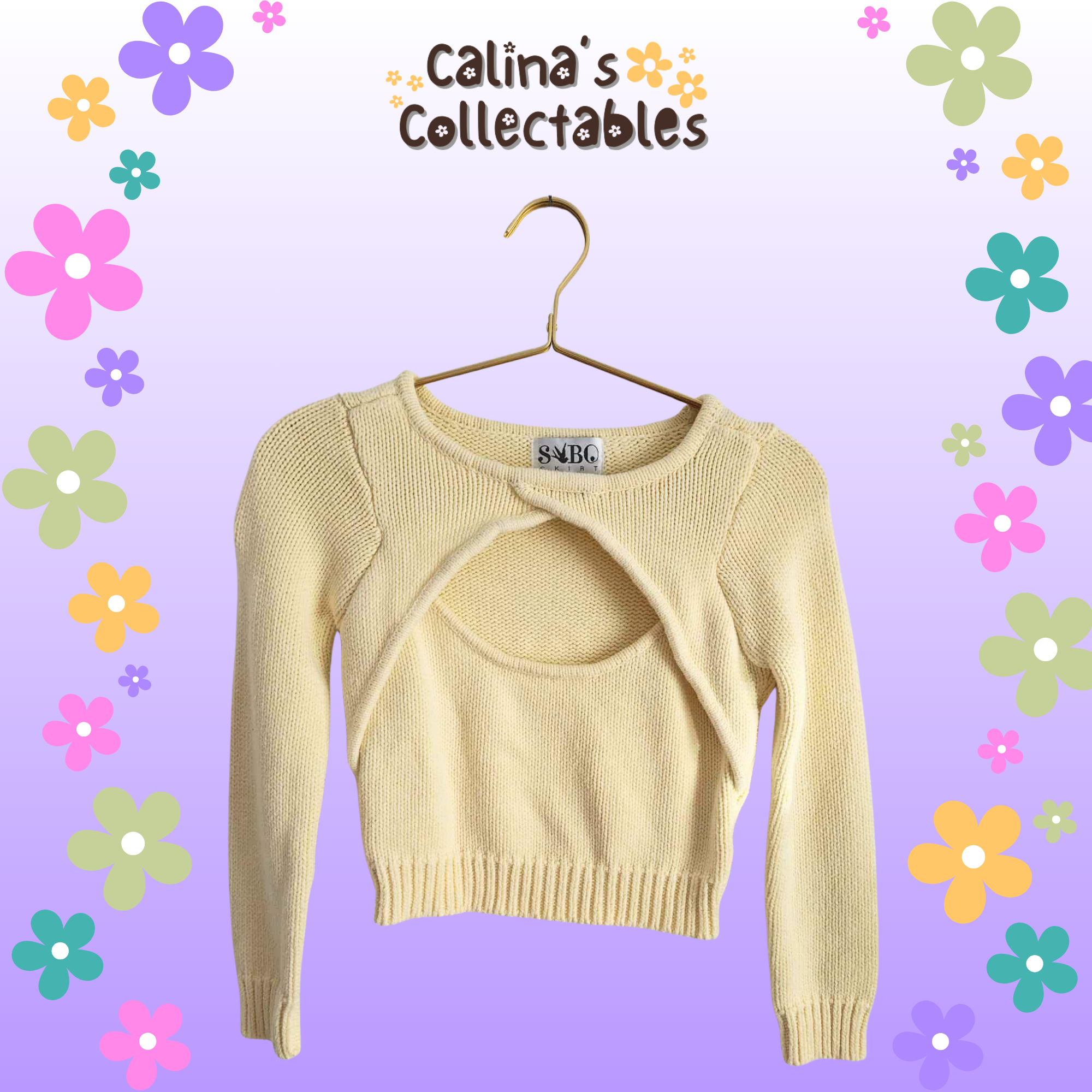 Yellow sweater with keyhole design, "Calina's Collectables" logo, on hanger.