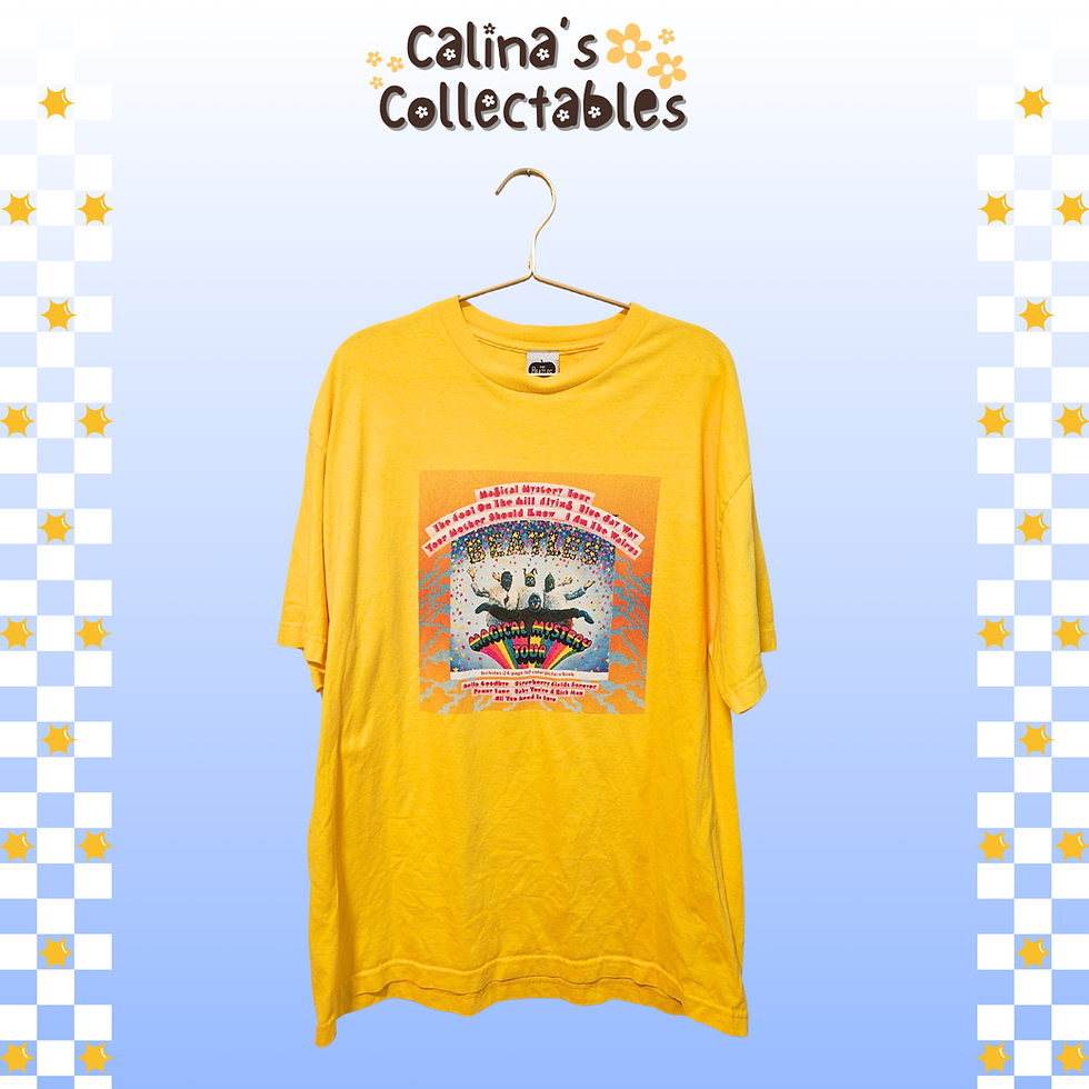 Thumbnail: Yellow t-shirt with print, Calina's Collectables logo in the background.