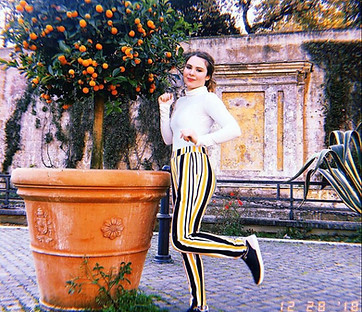 Photo of owner beside plant