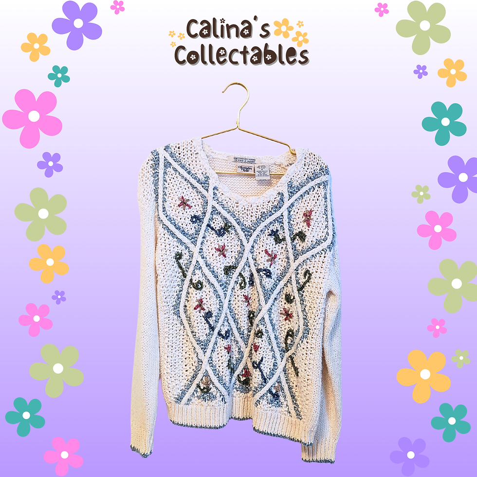 Thumbnail: White sweater with floral embroidery. Calina's Collectables on display. 