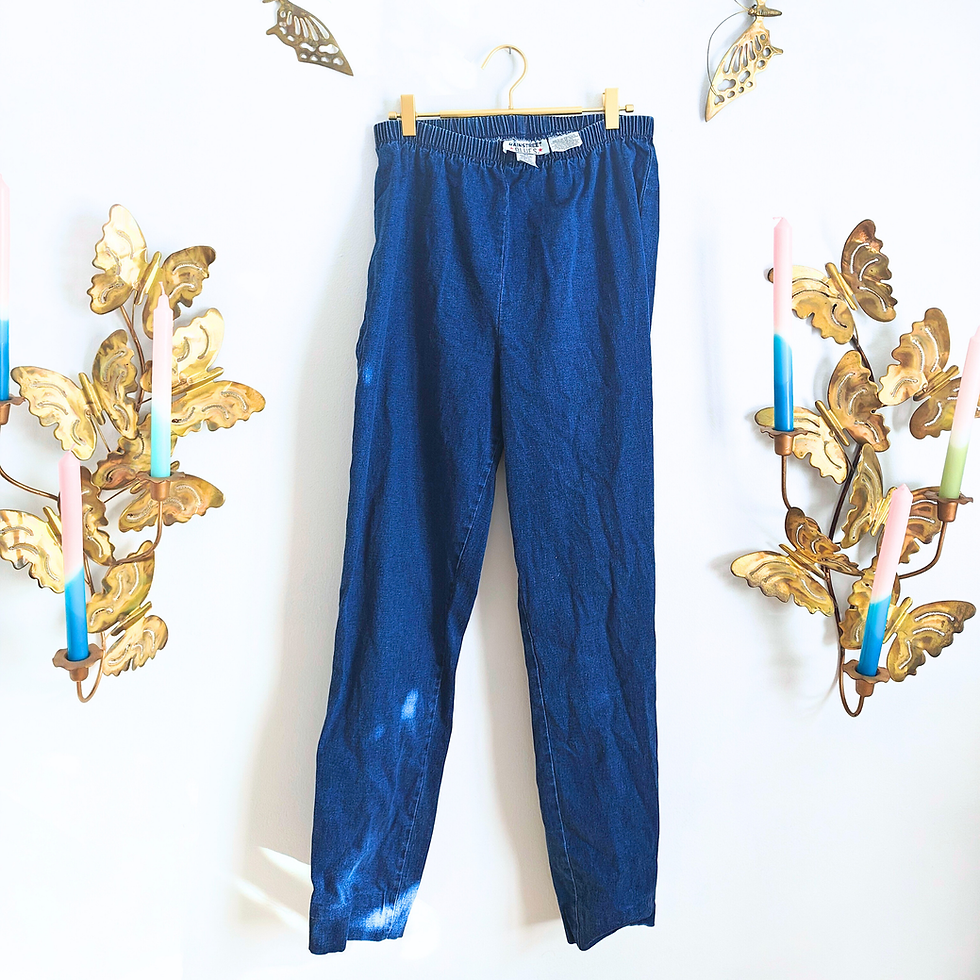 Thumbnail: Blue pants hanging on a rack, white background, home decor, casual wear.