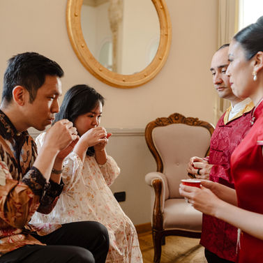 Two couples perform a traditional tea ceremony