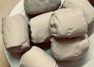 wedged clay on pottery wheel