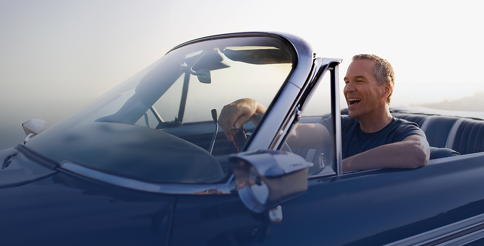 Smiling couple in a car – auto insurance protection and peace of mind