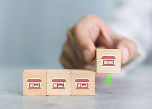 franchise-businessbusinessman-hand-choose-wooden-blog-with-franchise-marketing-icons.jpg